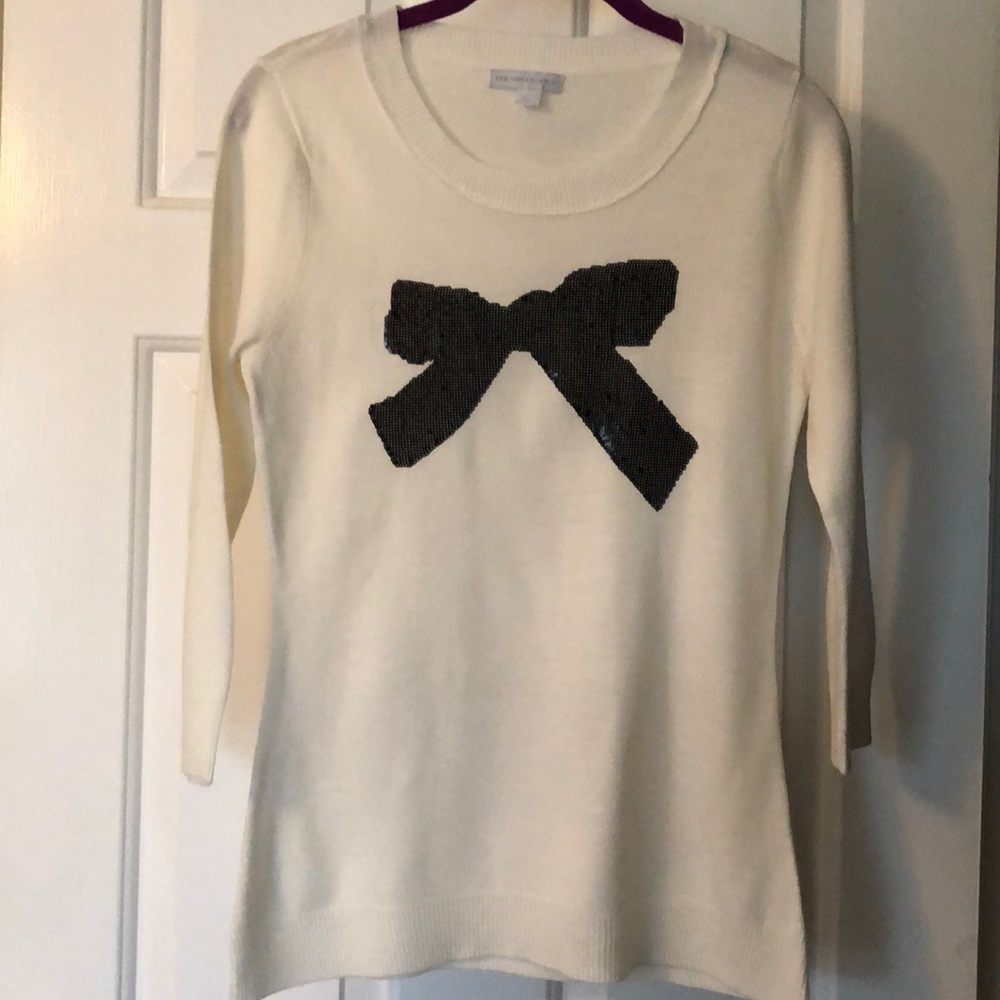 Sweater with sequin bow